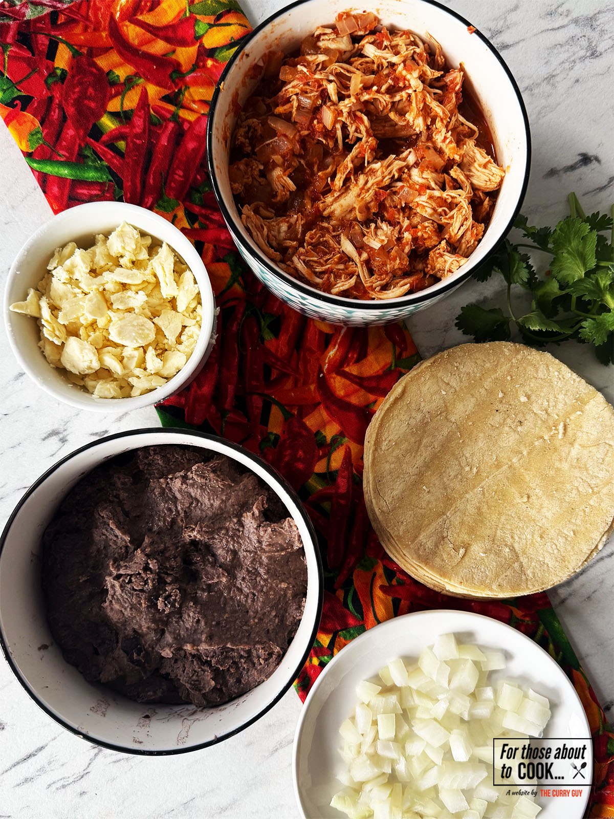 Ingredients for tostadas de tinga separated into a bowl