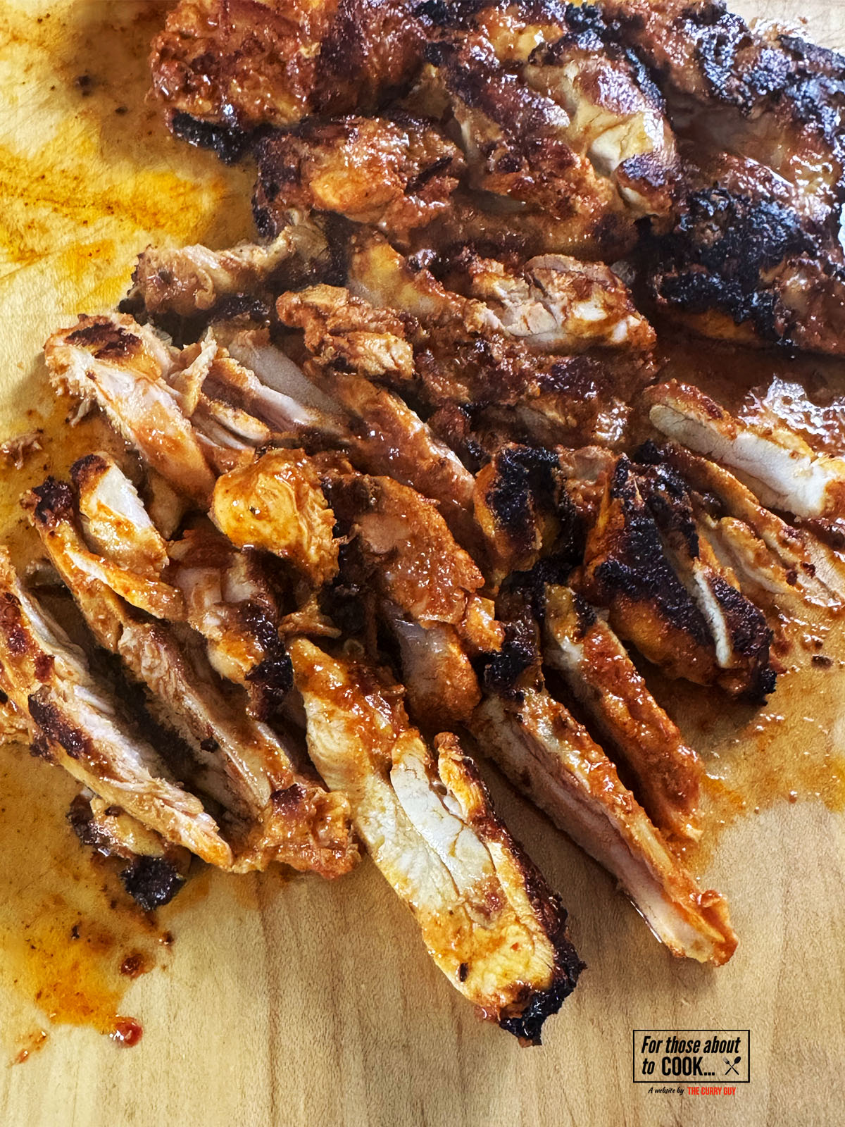 shredding the chicken using a sharp knife