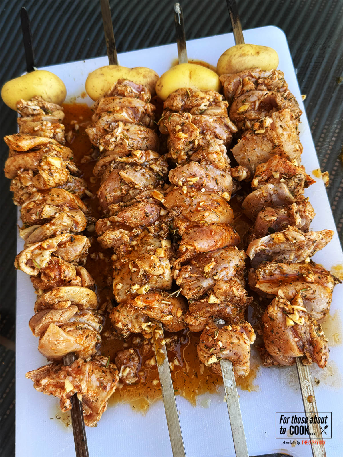 The chicken skewered and ready to cook.