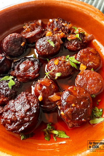 Chorizo in red wine served in a tapas dish