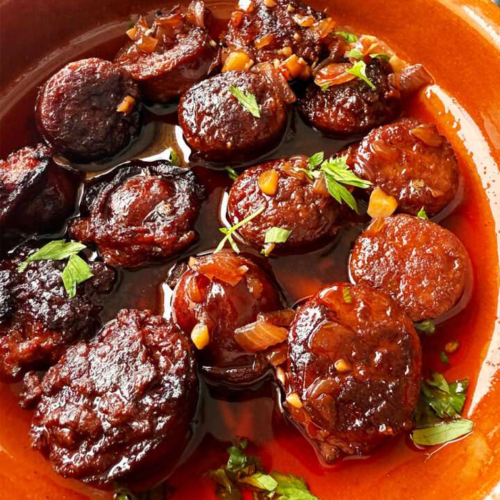 Chorizo in red wine served in a tapas dish