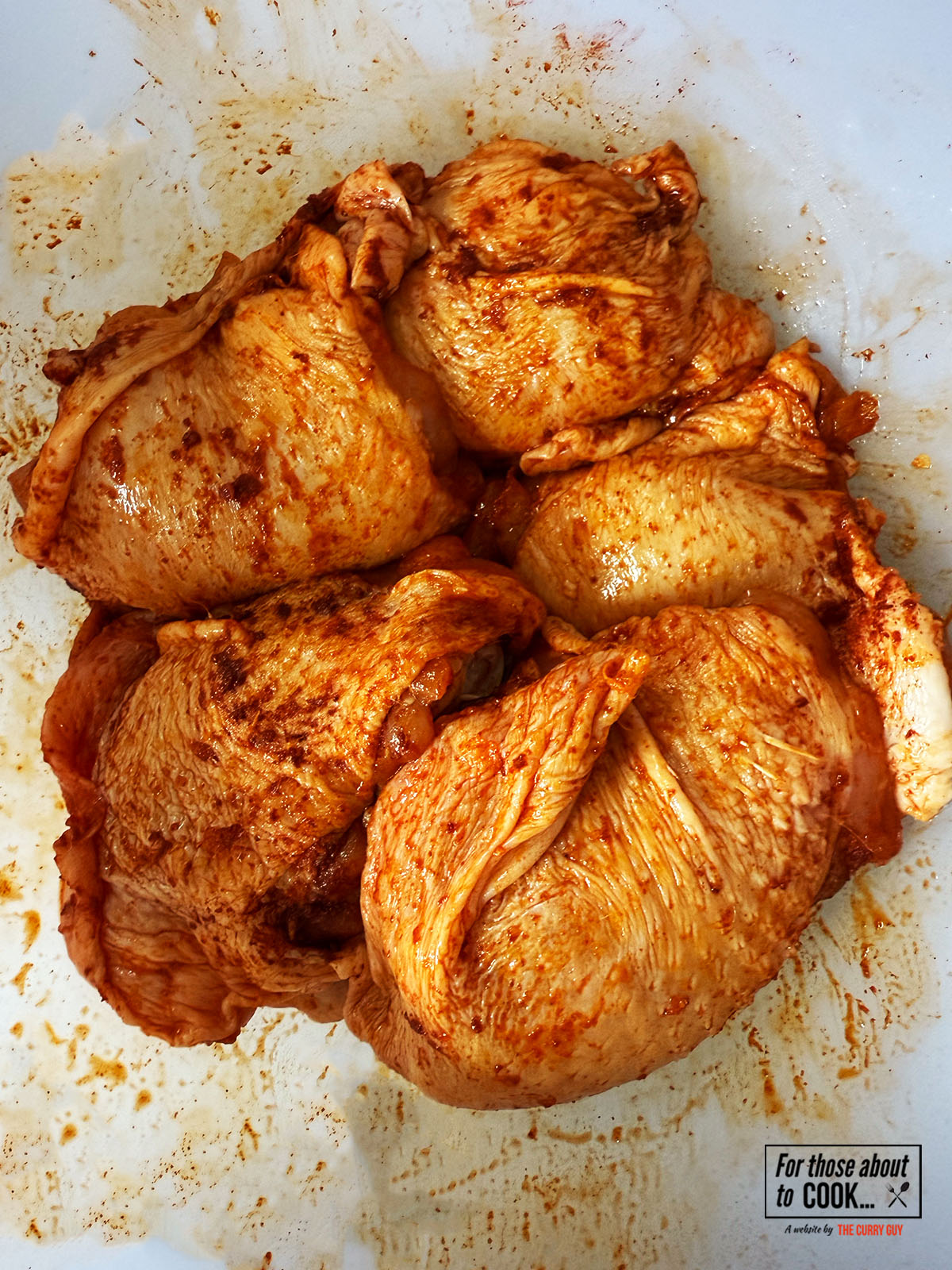 Chicken thighs coated in paprika and salt