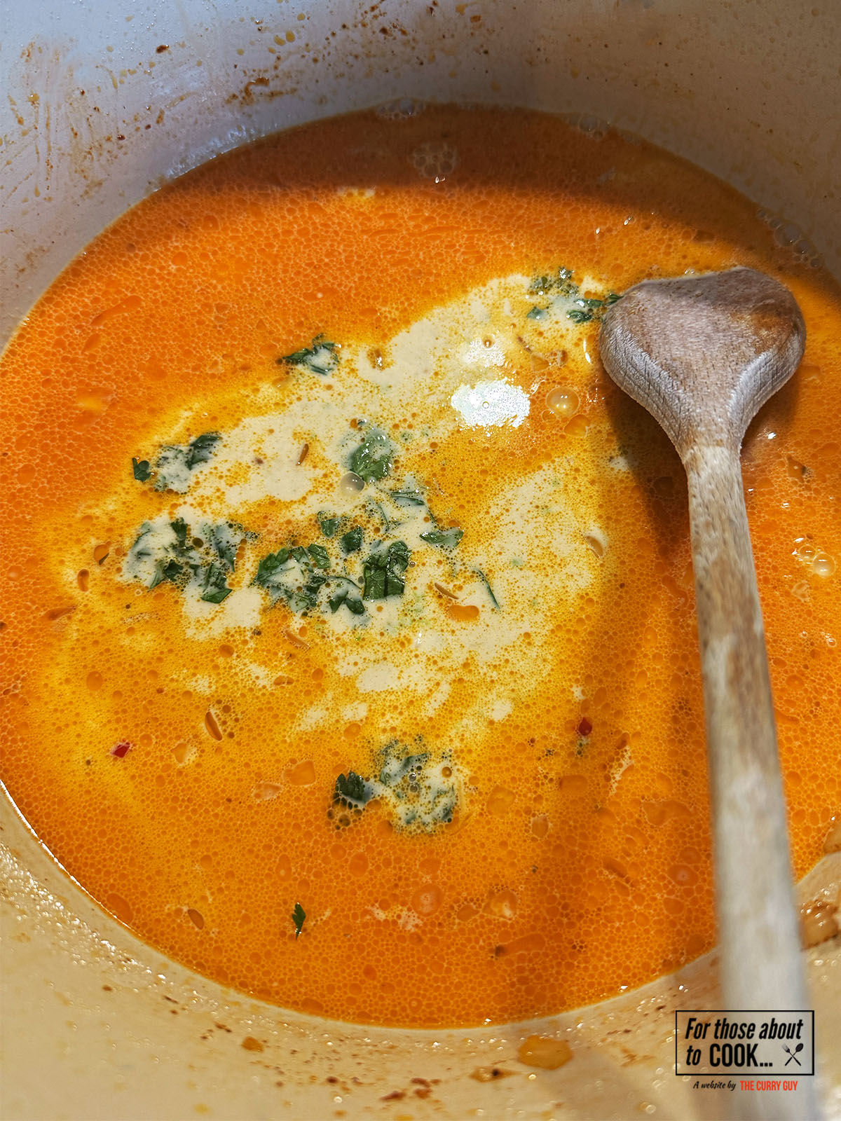 Lime zest and coriander added to the curry