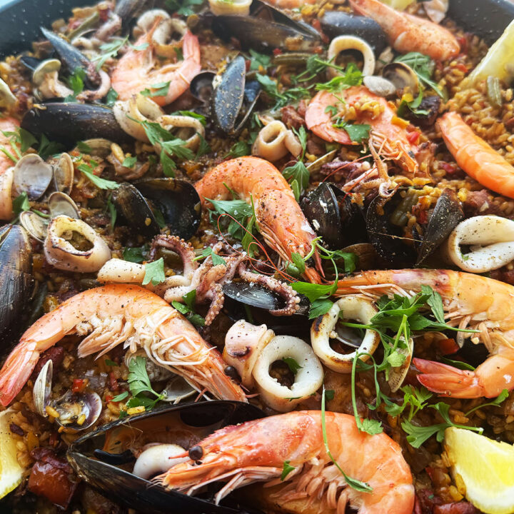 Paella mixta presented in a paella pan