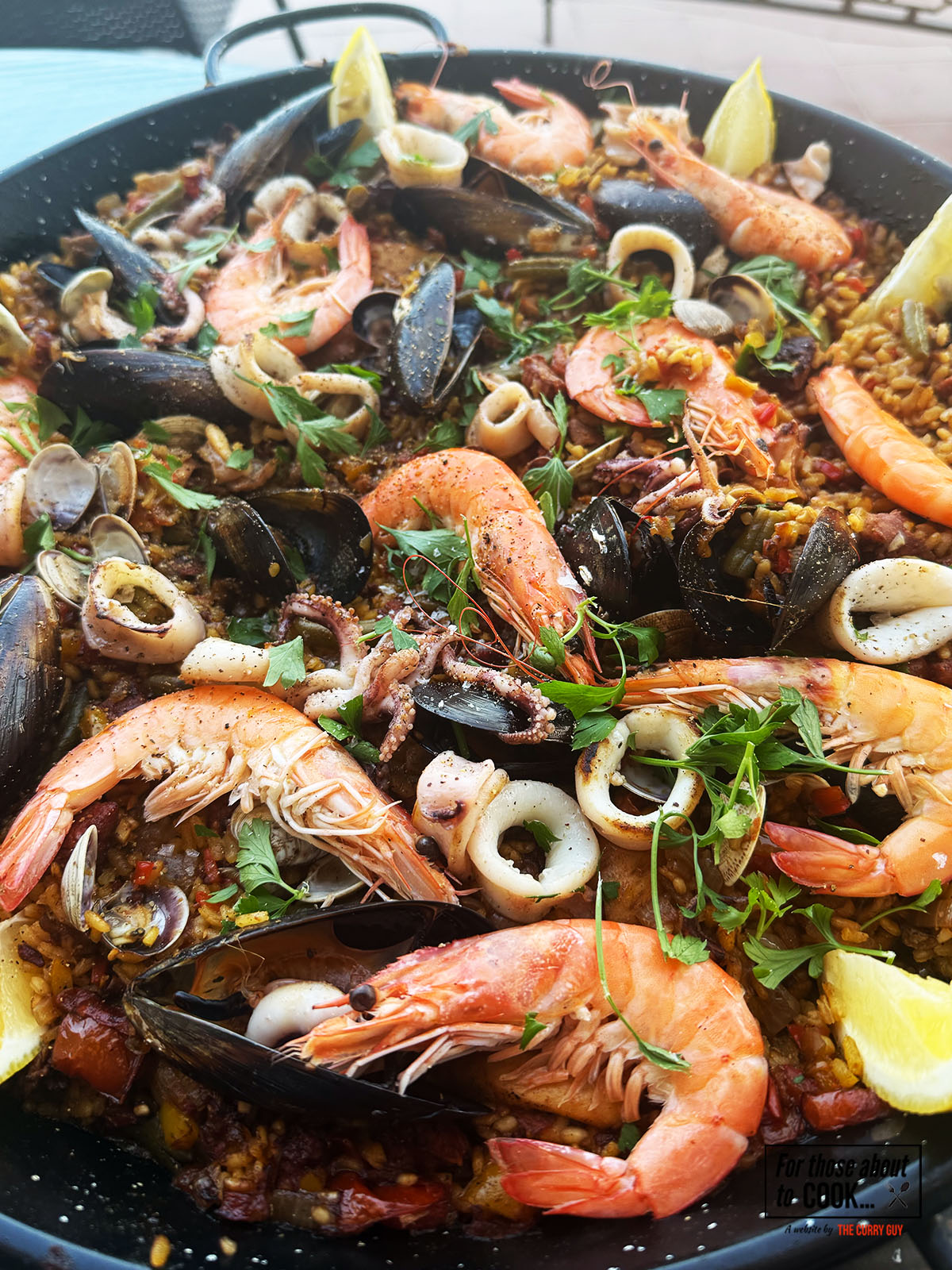 Paella mixta presented in a paella pan