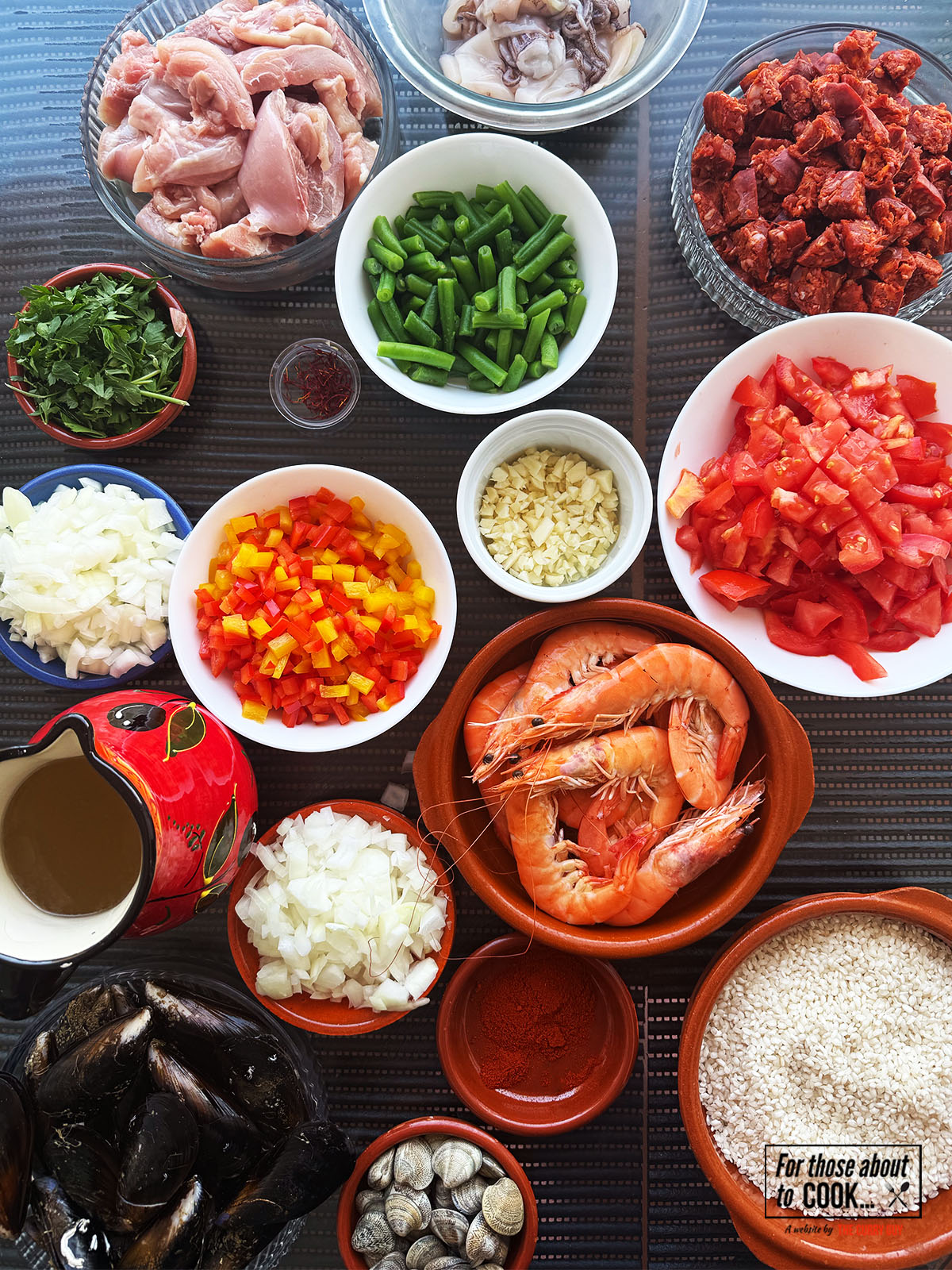 Ingredients for Paella Mixta separated in to bowls