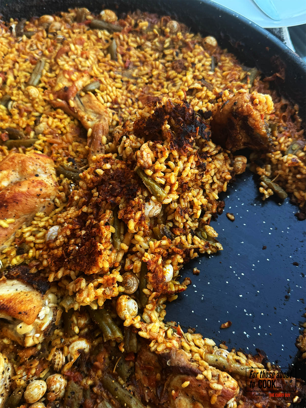 The finished paella showing the socarrat.