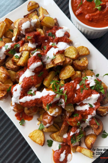 Patatas bravas served with a spicy tomato sauce