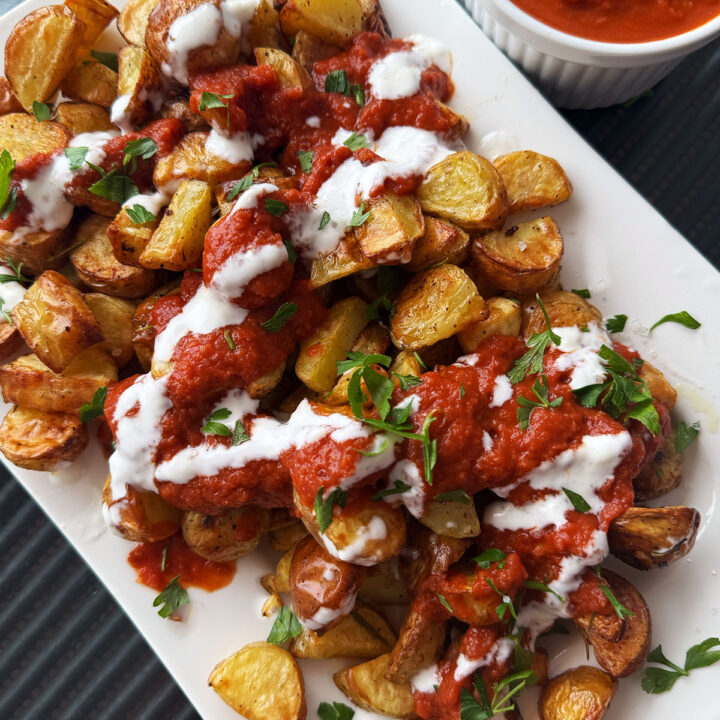 Patatas bravas served with a spicy tomato sauce