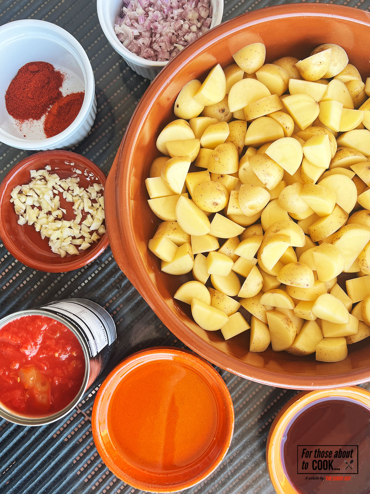 Ingredients for patatas bravas portioned onto plates