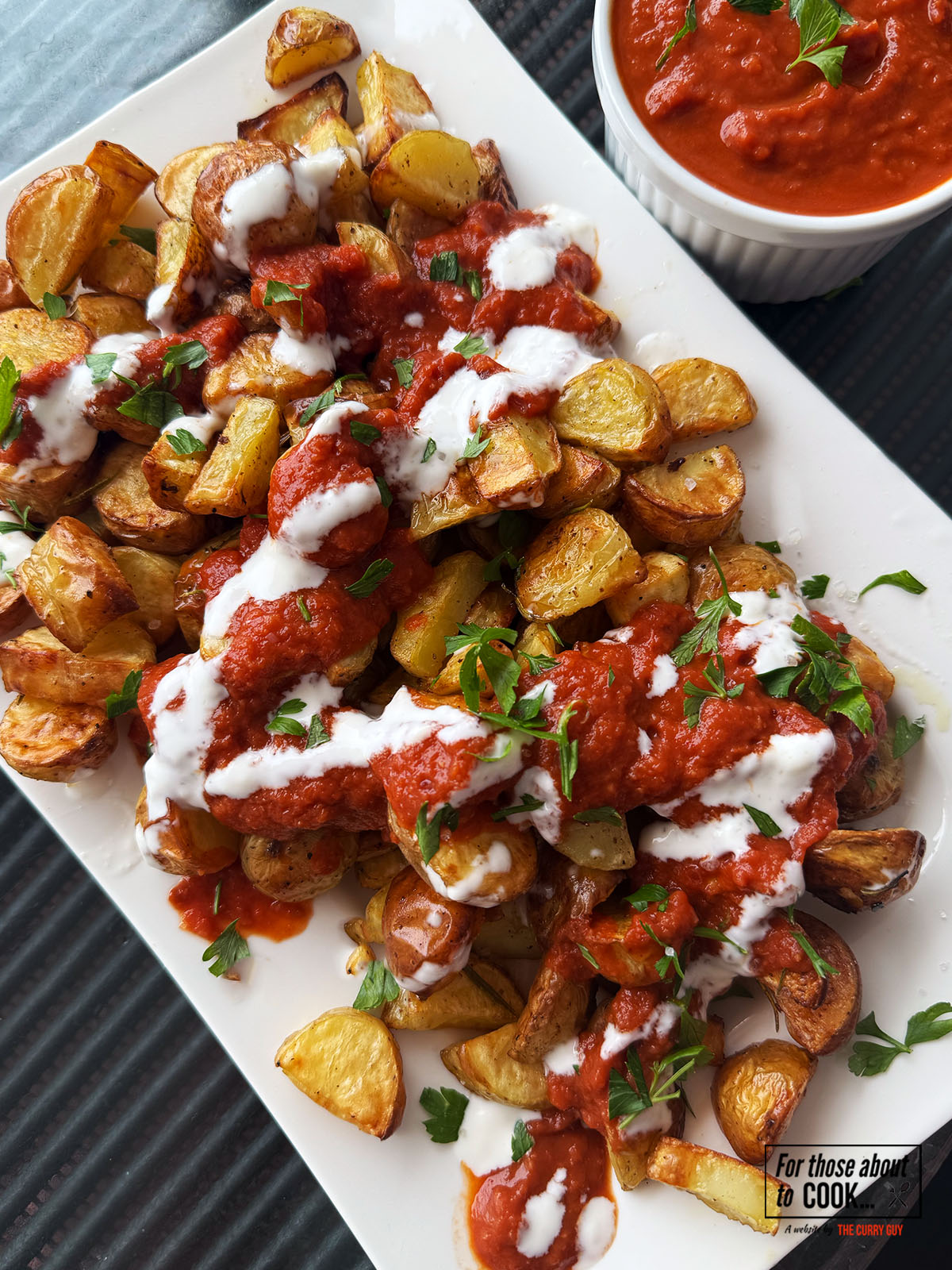 Patatas bravas served with a spicy tomato sauce