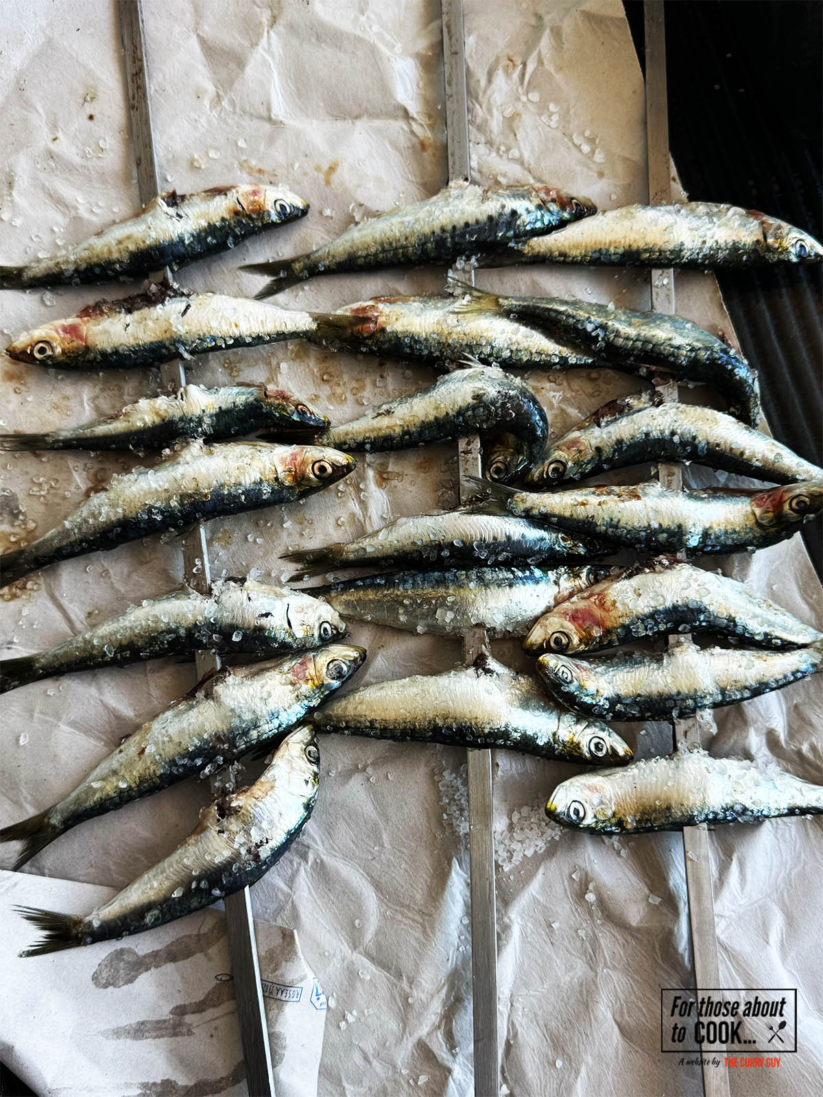 Skewering the sardines.