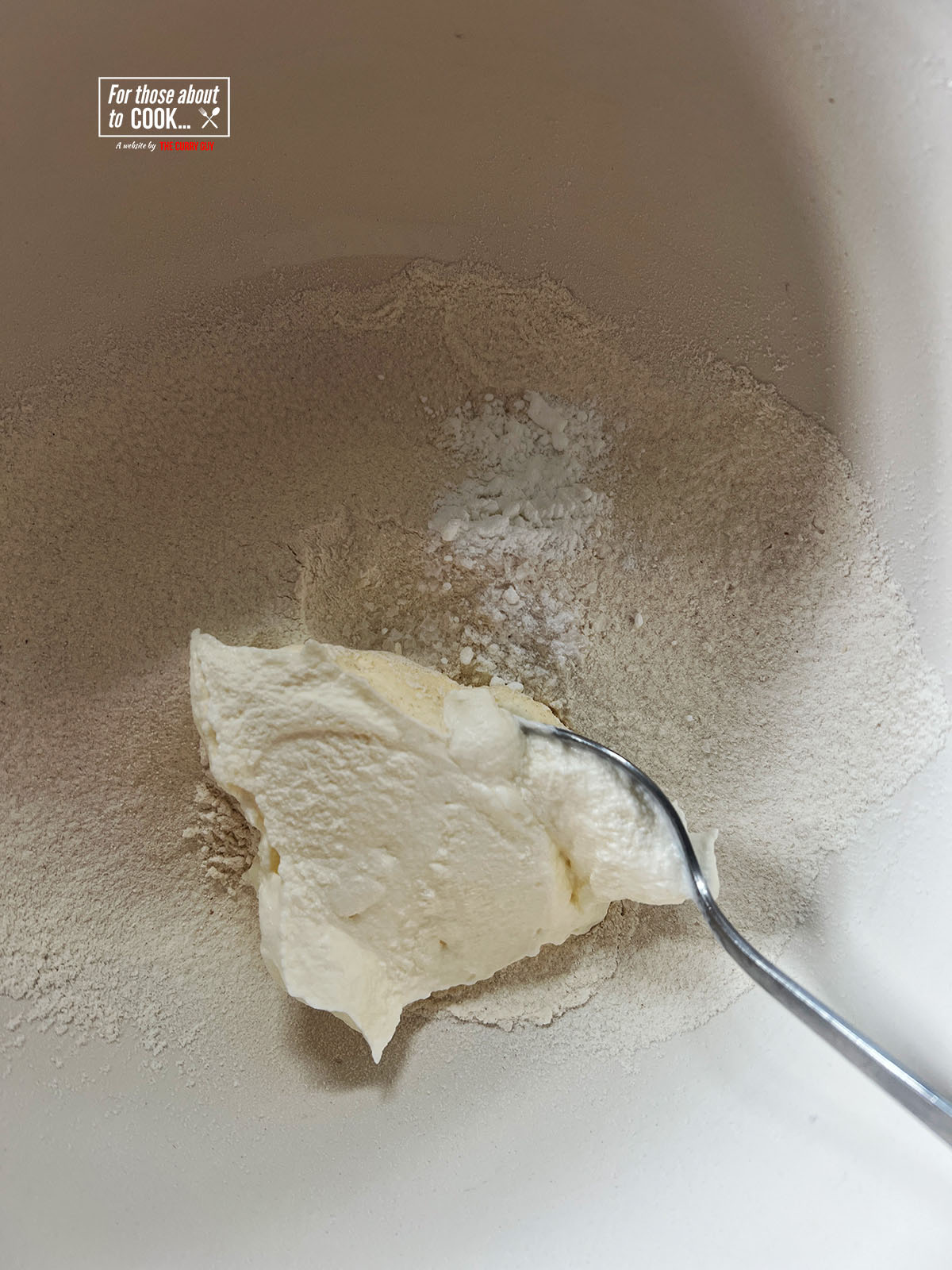adding yoghurt to the flour