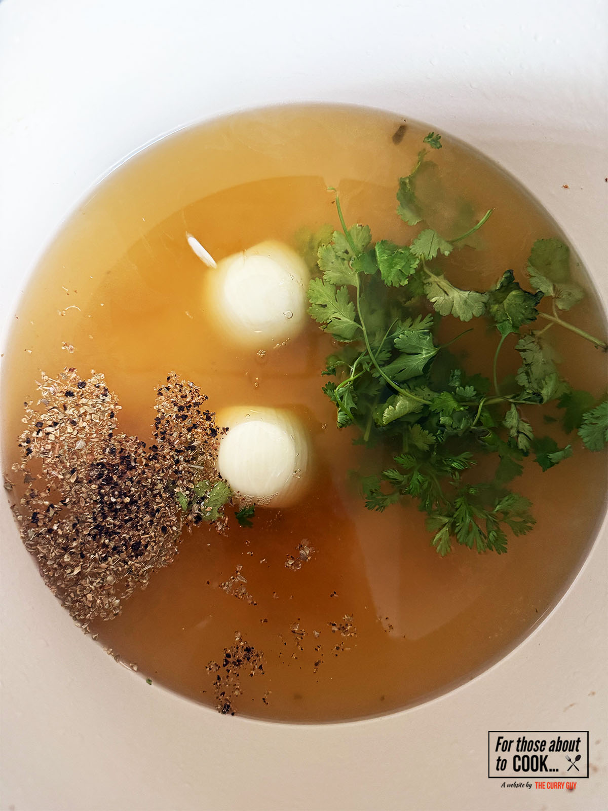 Heating the stock in a pan. 