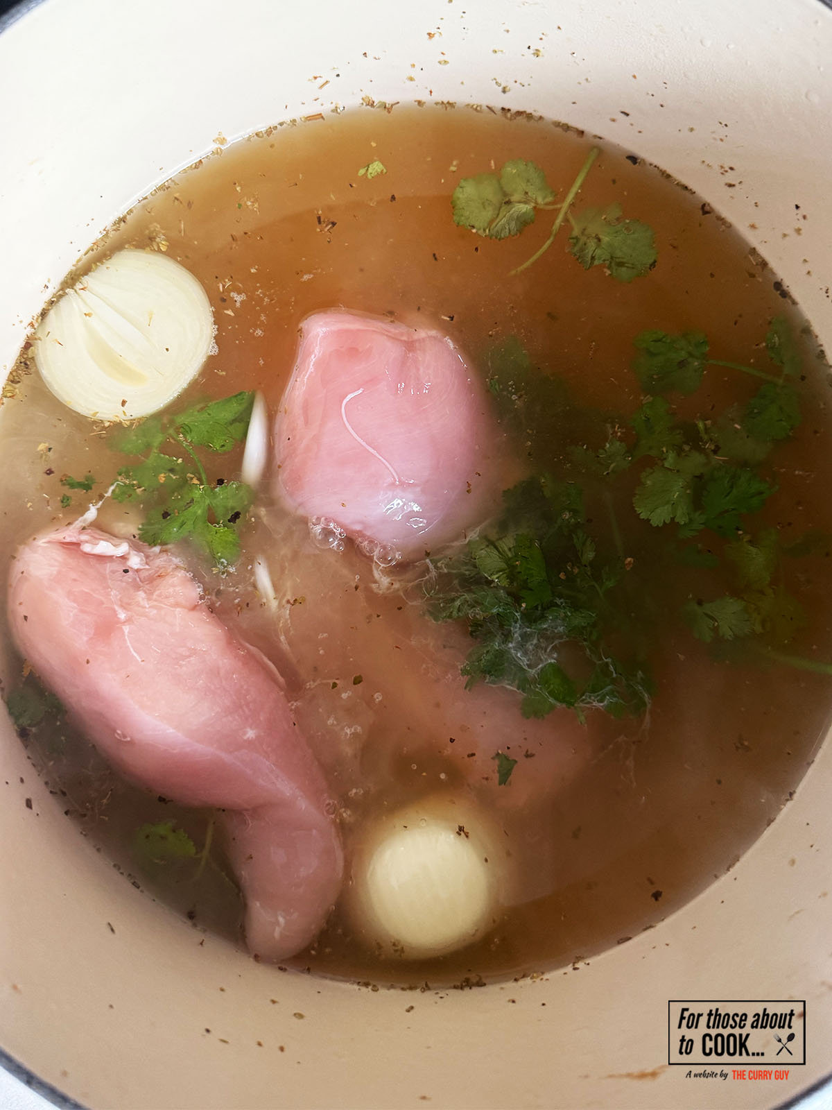 Poaching the chicken in the stock