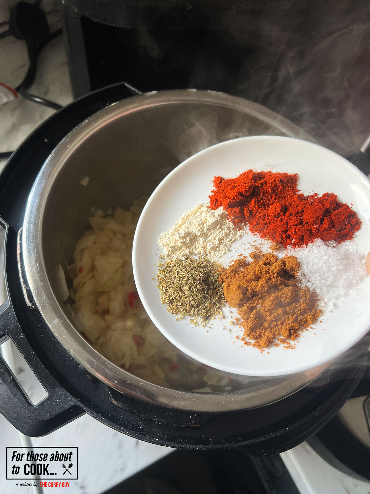 adding the spices to the pan