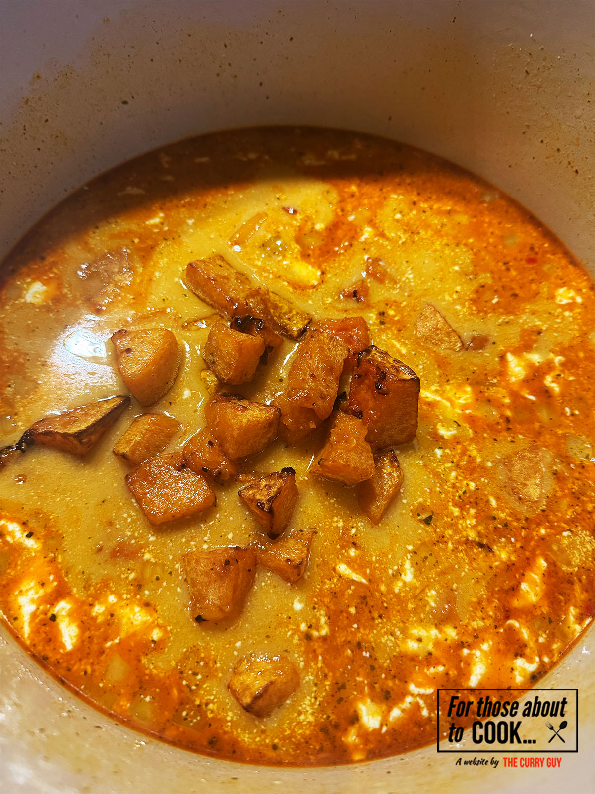 Roasted butternut squash added to the pot