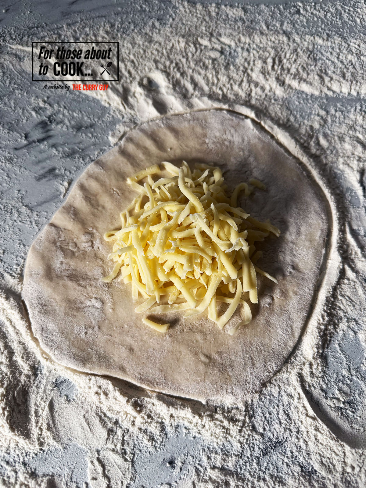 filling the naan with cheese