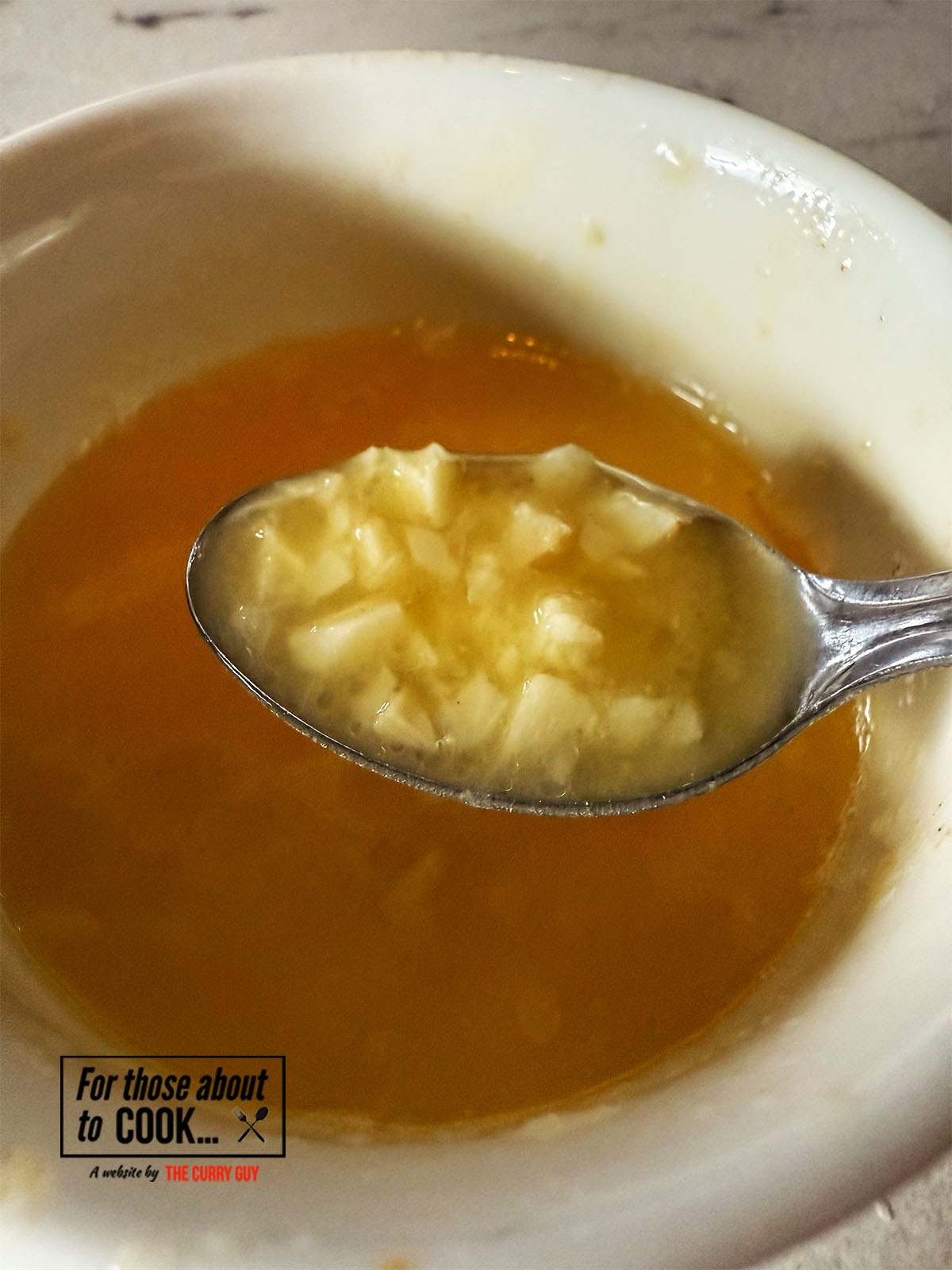Making garlic butter to drizzle over the cheese naan