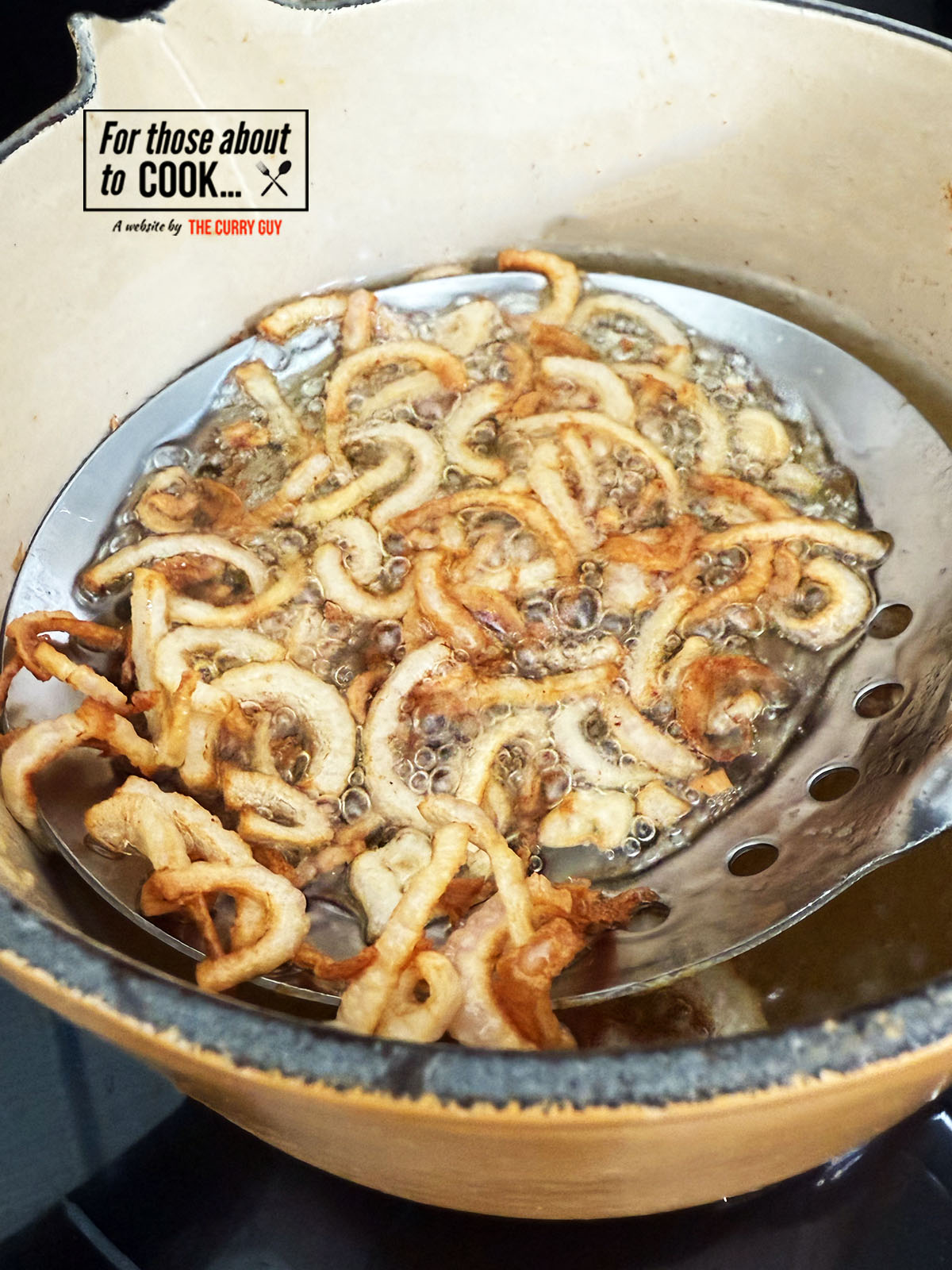 Frying the shallots for the philly cheesesteak recipe