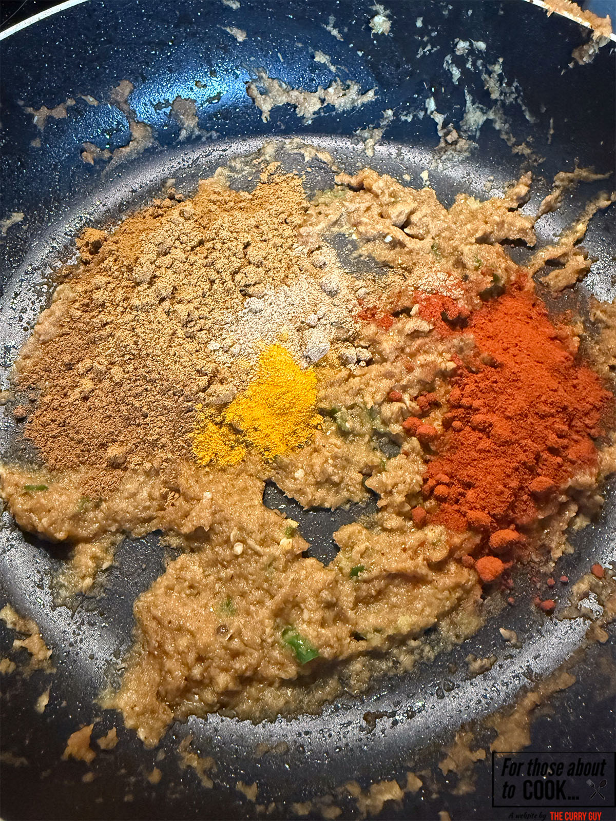 Ground spices added to the pan
