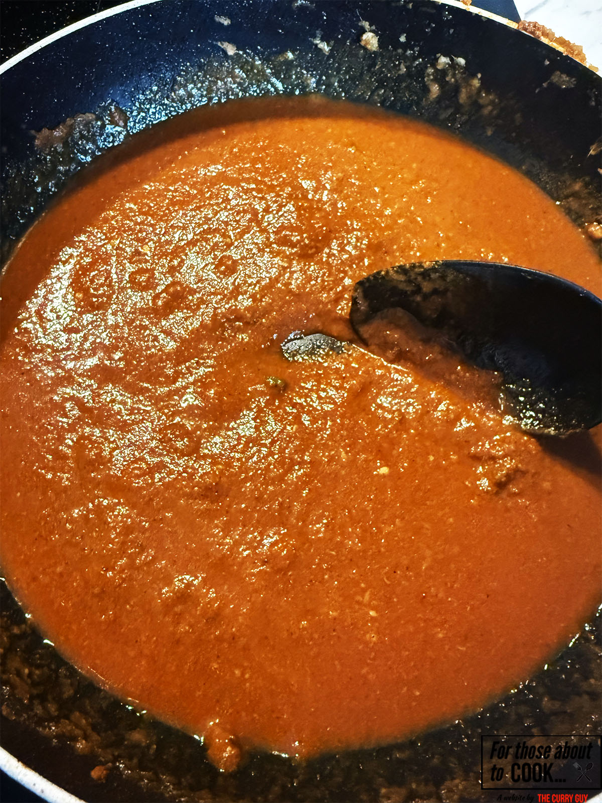 Passata and chicken stock added to the pan