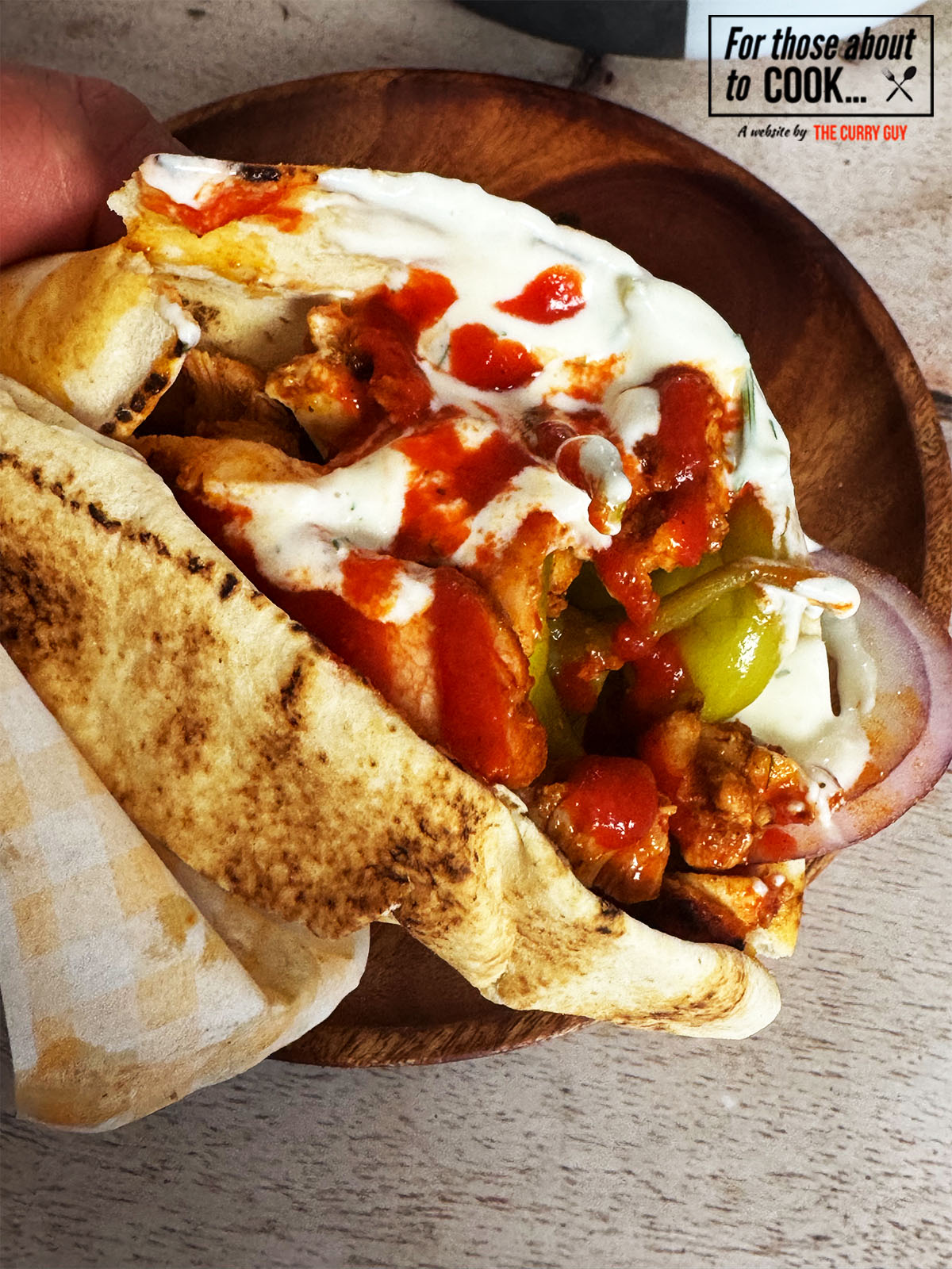 Chicken shawarma in a wrap with sauce