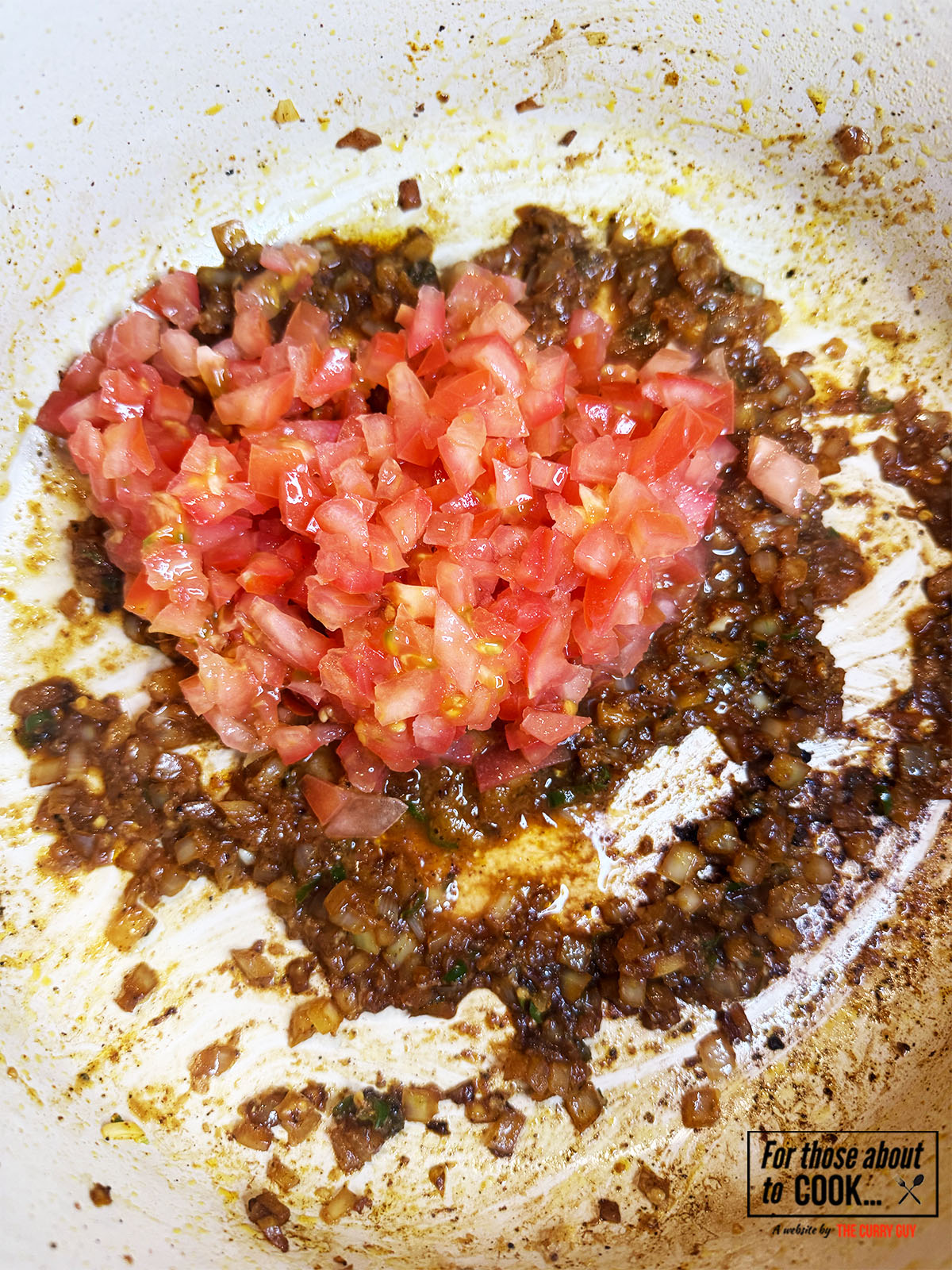 chopped tomatoes added to the coconut chicken dish.