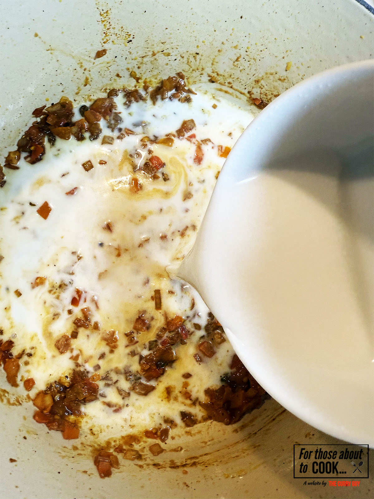 coconut milk added to the pan