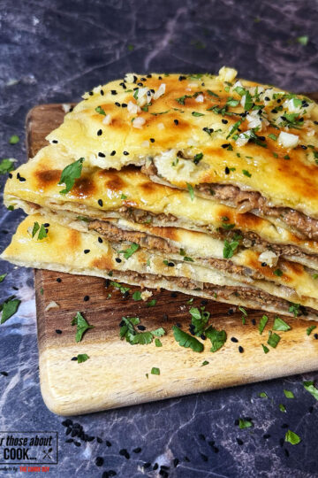 Keema naan cut in half to see the lamb meat