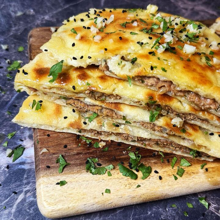 Keema naan cut in half to see the lamb meat