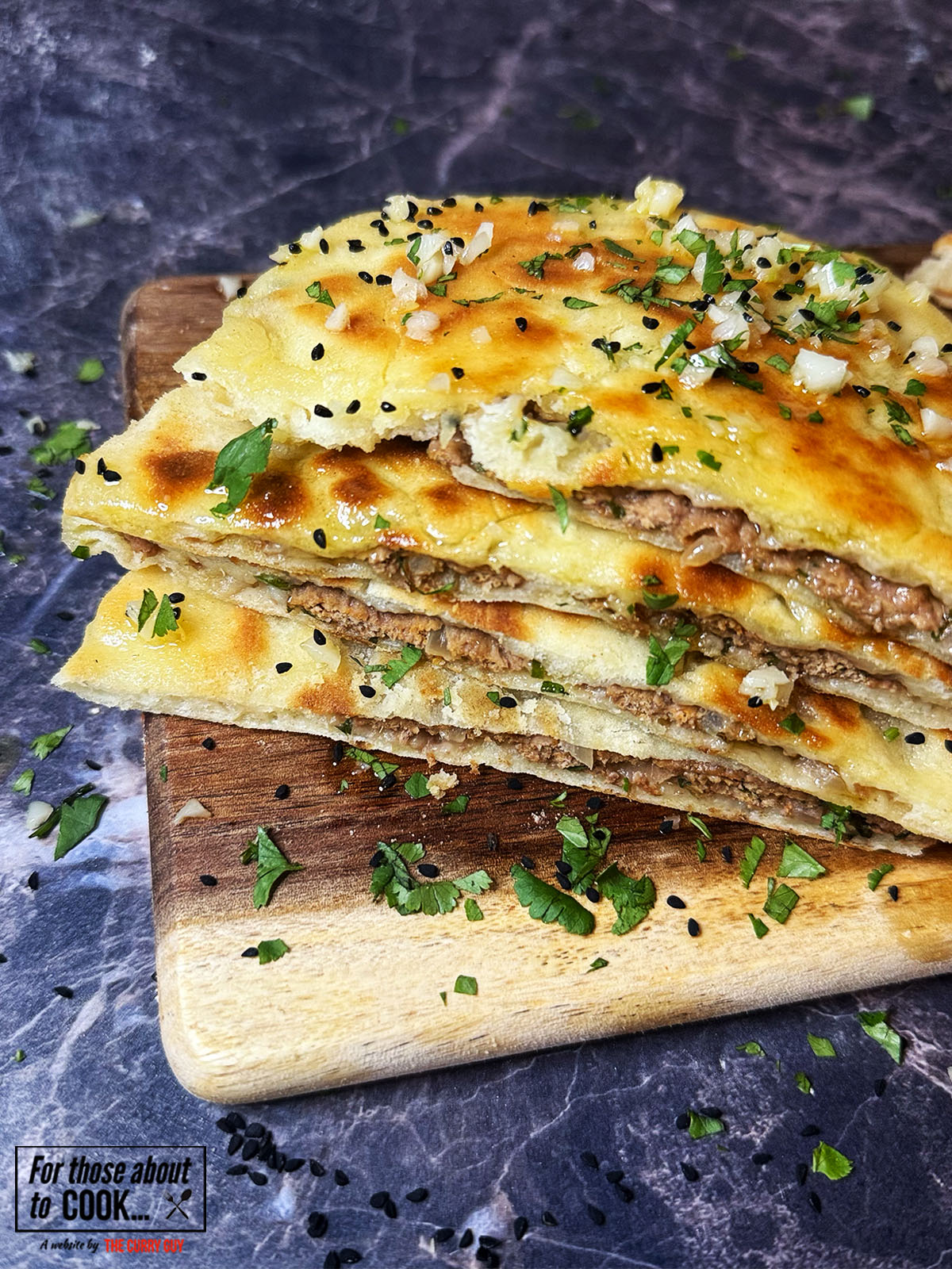 Keema naan cut in half to show meat