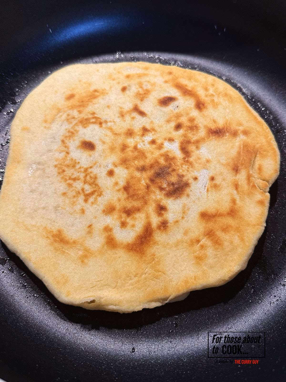 Naan frying in a pan