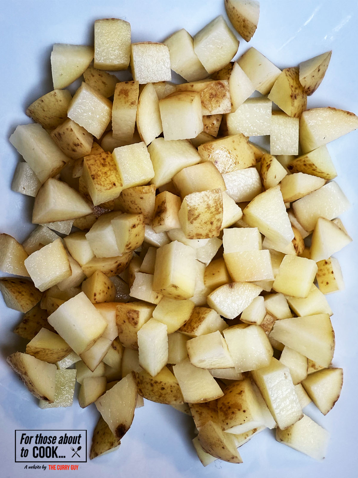 washing and cubing the potatoes