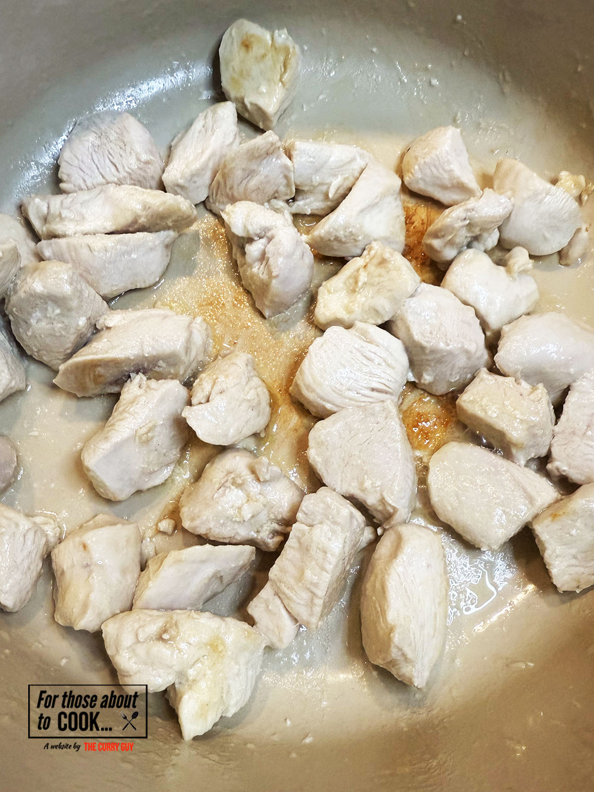 Chicken browning in a pan