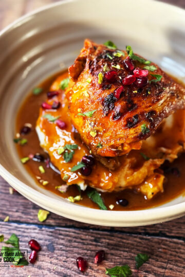 Honey harissa chicken served on a bed of mashed potato with harissa chicken gravy