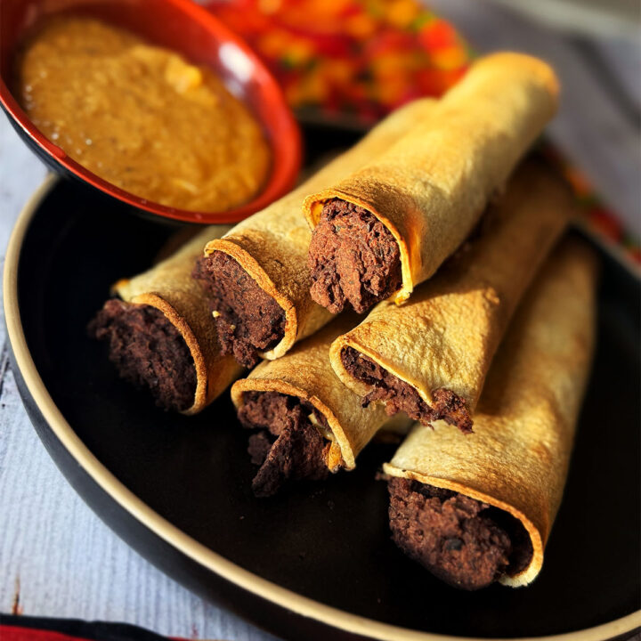 Refried bean taquitos served with chipotle dip