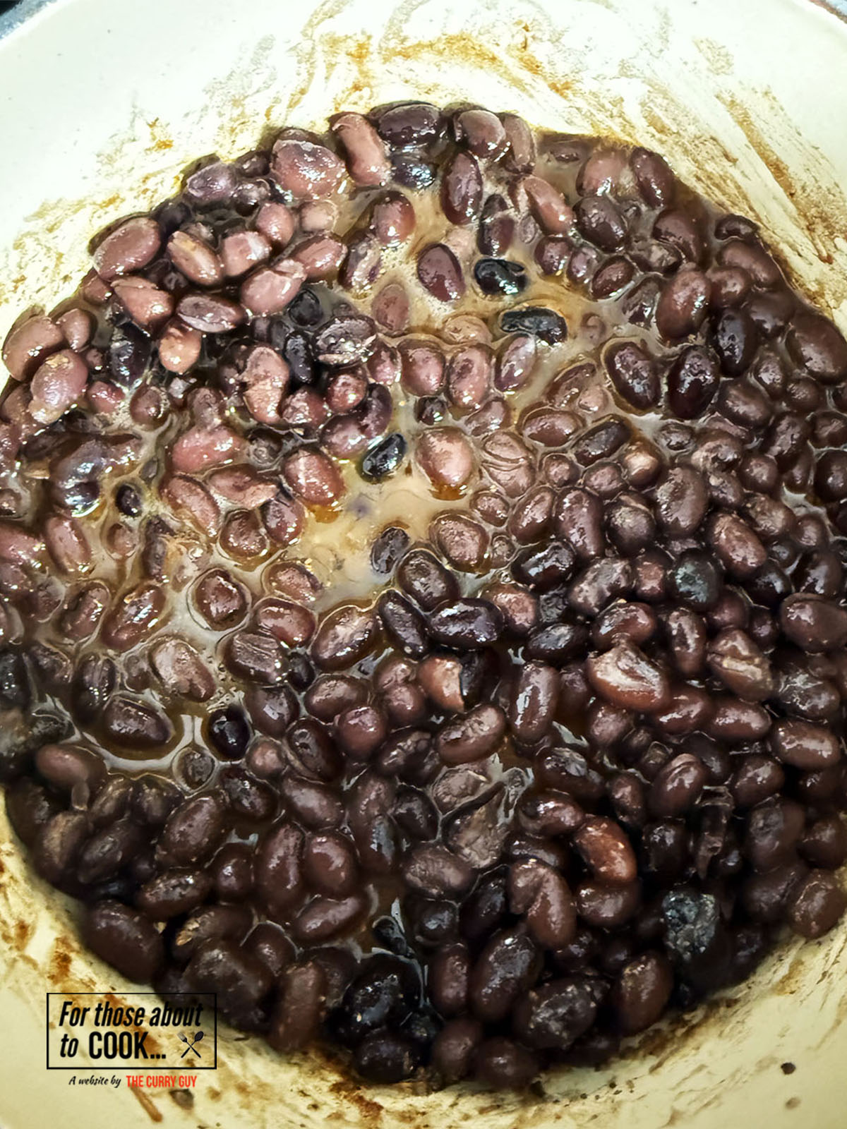 retained liquid added to the pot with the beans and spices