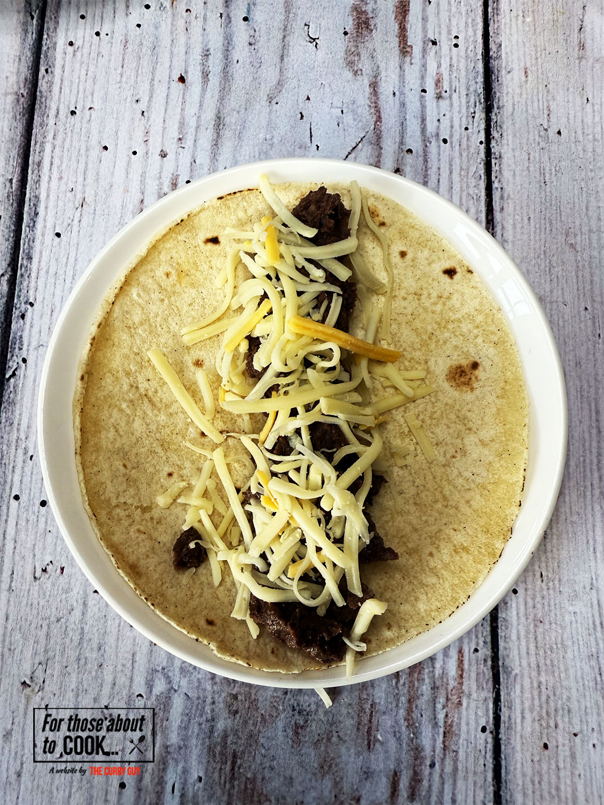 Cheese added to the refried bean taquitos 