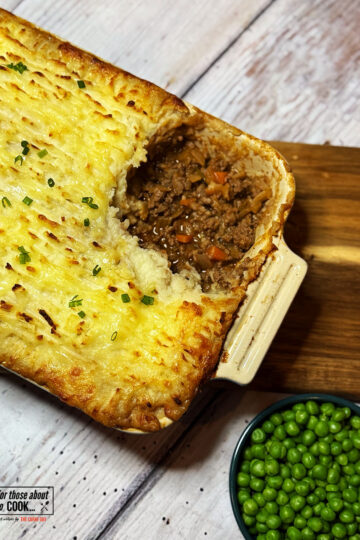 Cottage pie served with garden peas