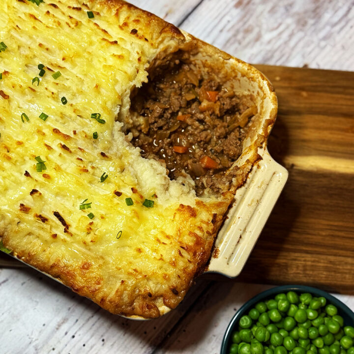 Cottage pie served with garden peas