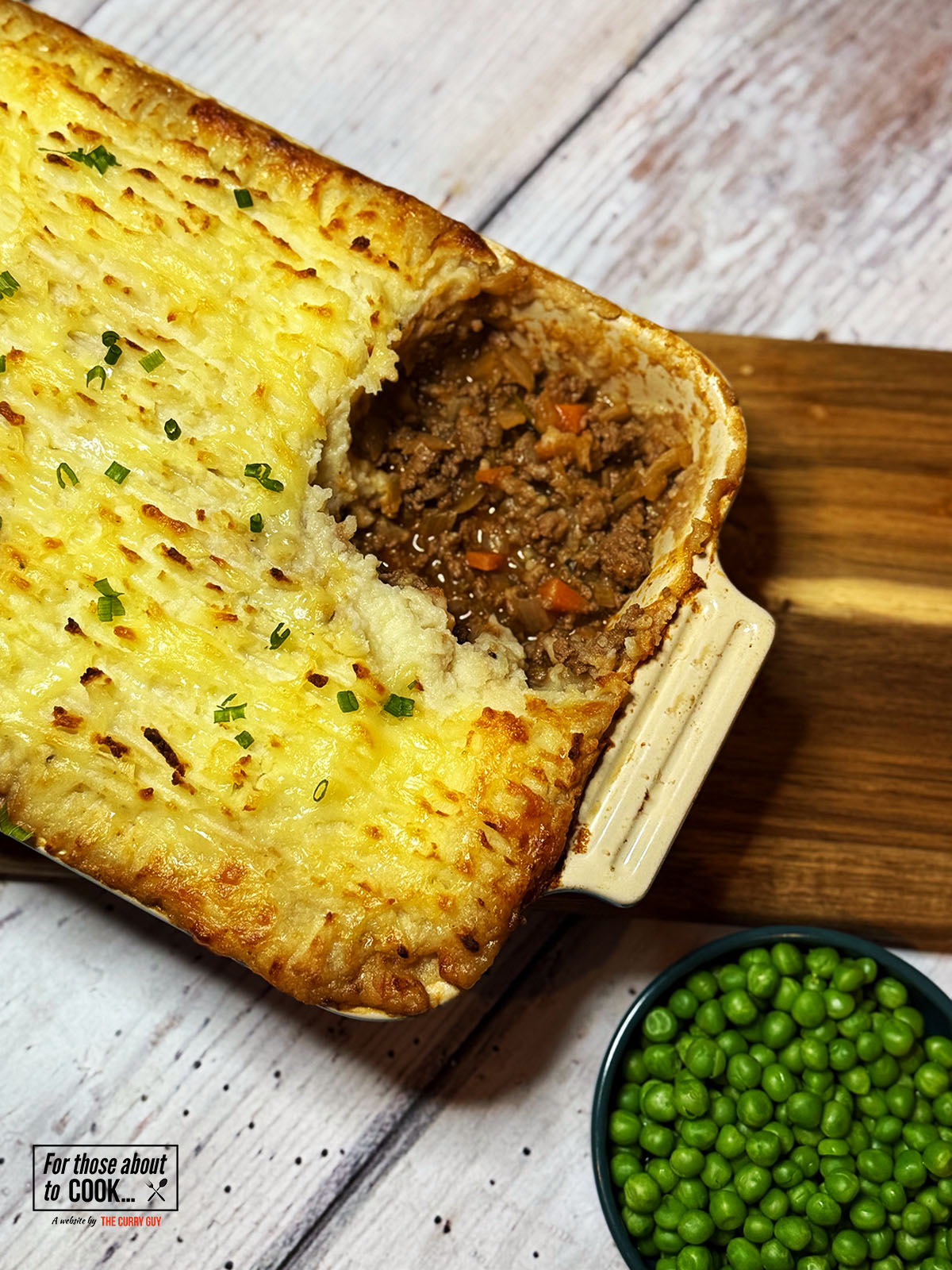 Cottage pie served with garden peas