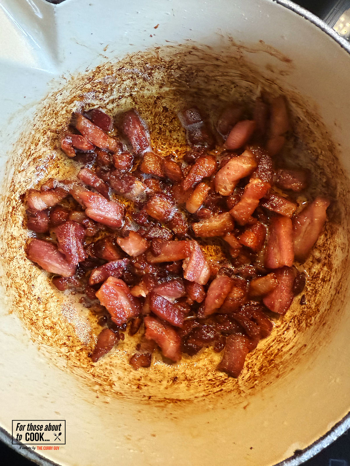 Bacon lardons frying until crispy