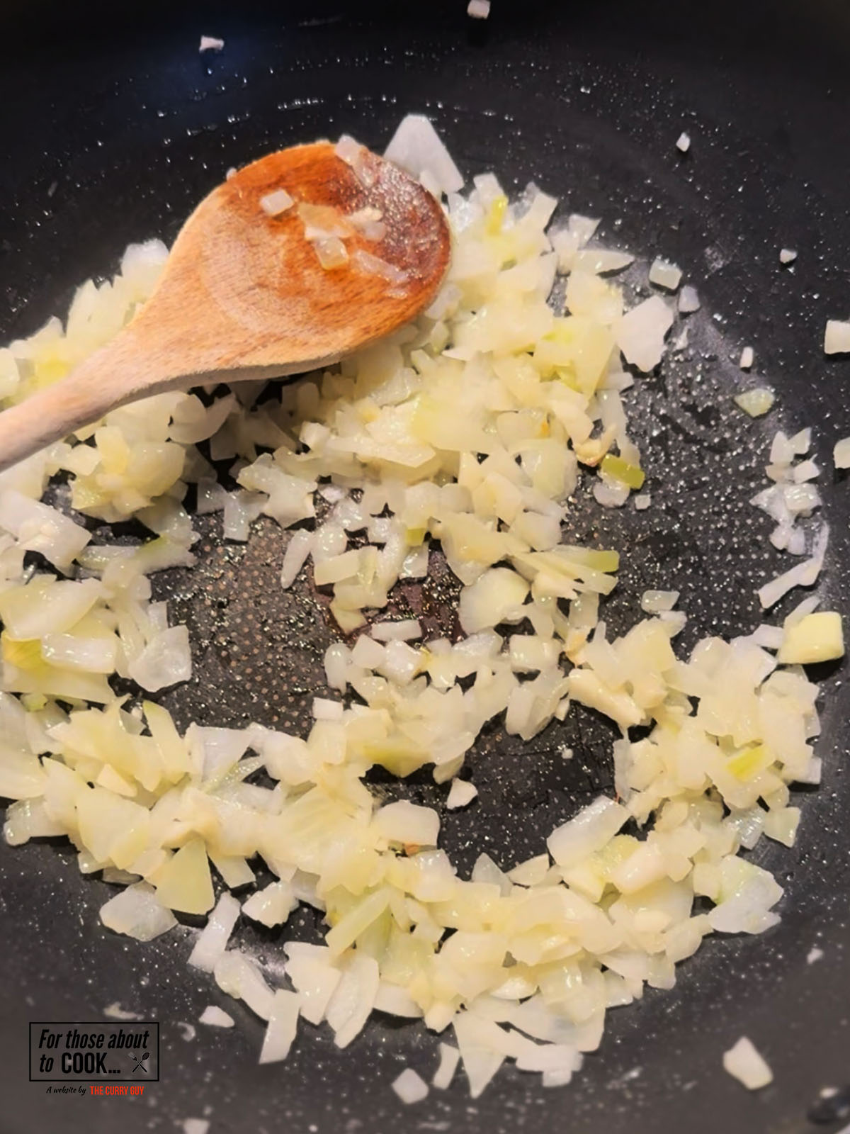 Onions frying in a pan until translucent