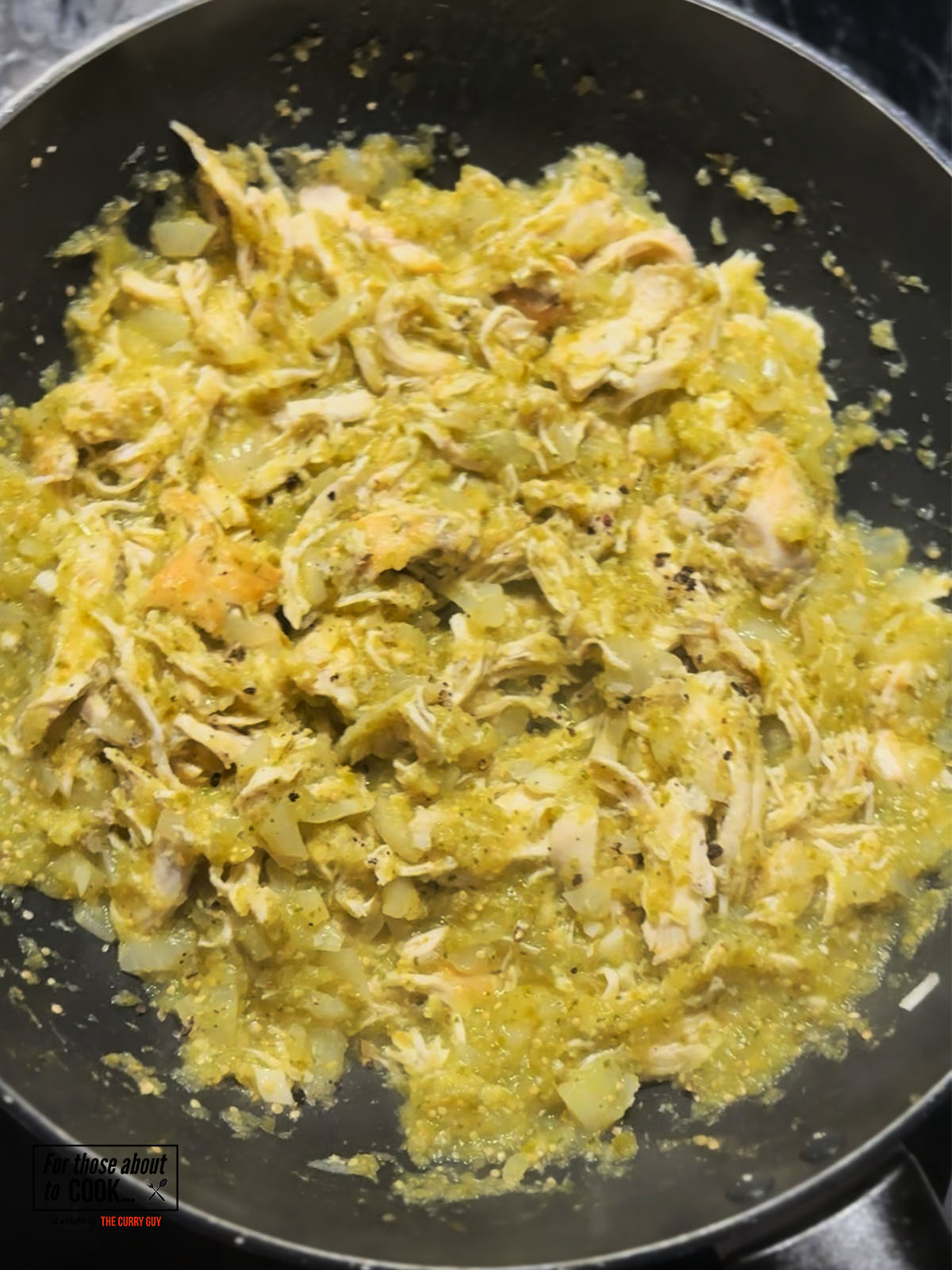 Shredded chicken returned to the pan and mixed well