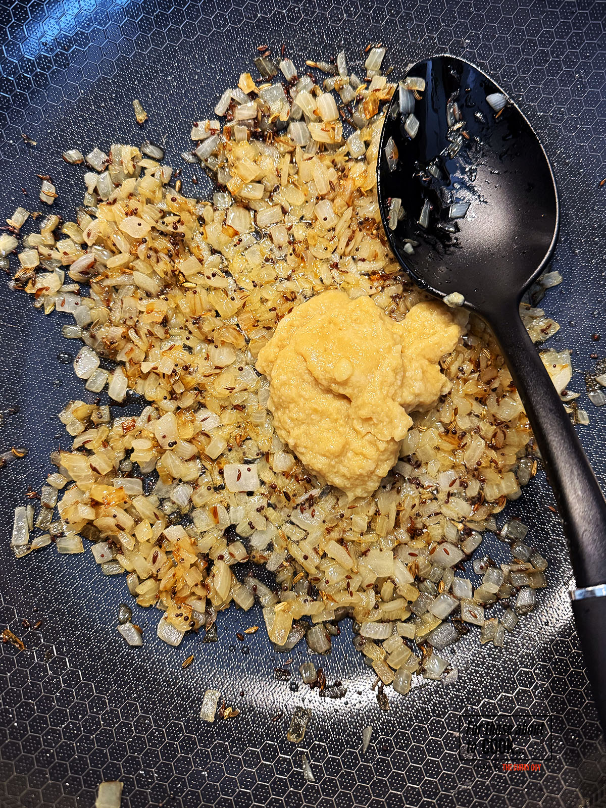 Ginger and garlic paste added to the pan