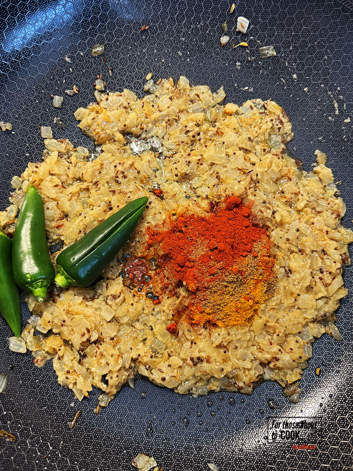 Ground spices and chillies added to the pan