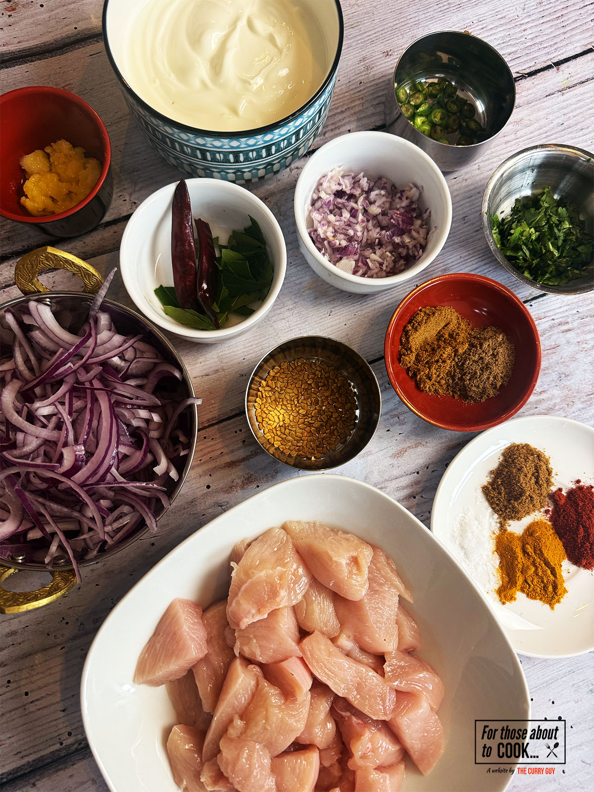 Ingredients for Chicken Chukauni separated into bowls 