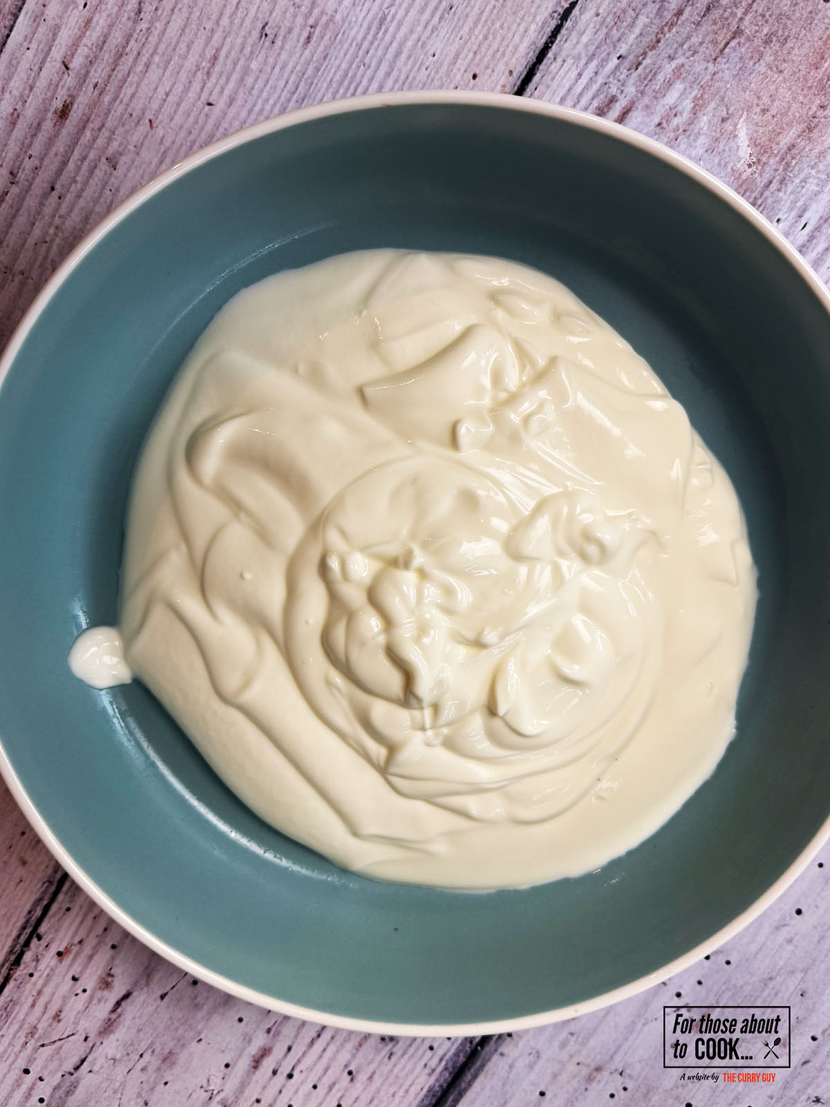 Thick yoghurt whisked in a bowl