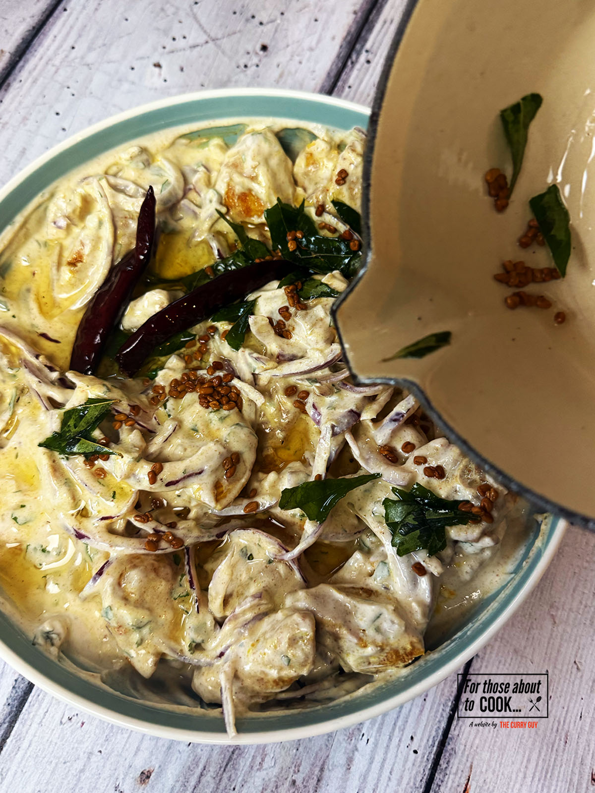 tempered oil poured over the chicken and yoghurt